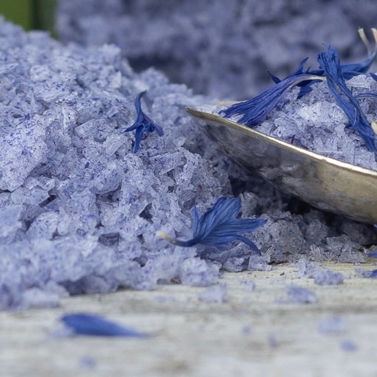 blue flower salt on a silver spoon